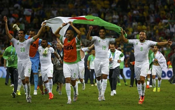 Algeria's national soccer team players celebrate after the match against Russia at the 2014 World Cup Group H soccer match at the Baixada arena in Curitiba