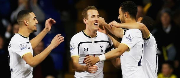 Nacer Chadli of Spurs celebrates with team mates as he scores their first goal