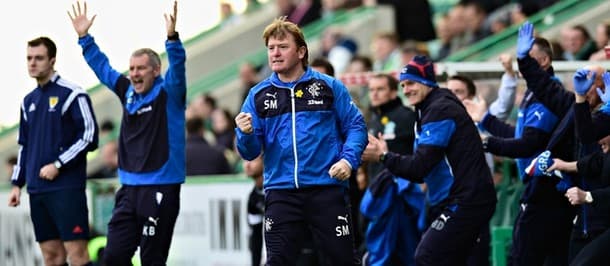 The Rangers manager Stuart McCall pumps his fist as his side take the lead against Hibs.