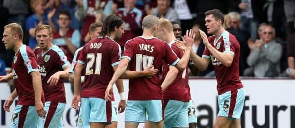 Burnley players celebrate the derby win over Blackburn