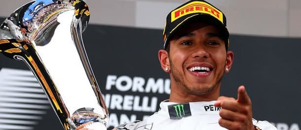 Lewis Hamilton holds the F1 Trophy