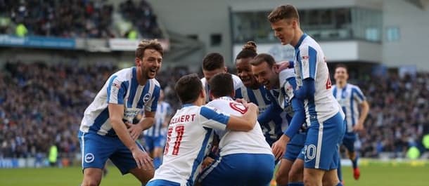 Brighton rose to the top of the table with a 3-0 win over QPR.