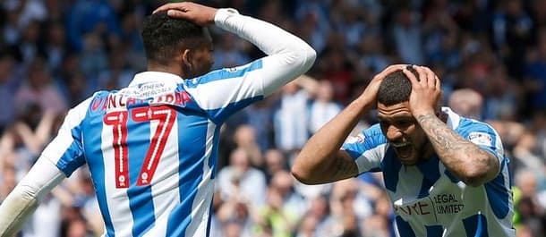 Sheffield Wednesday held Huddersfield to a draw in the first leg of the play off semi final.