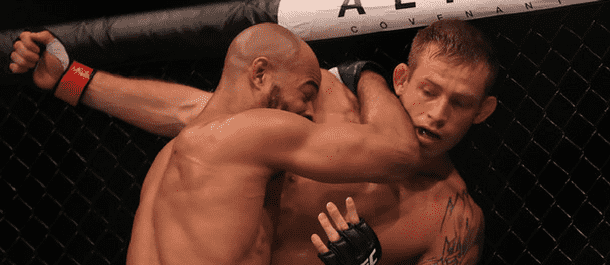 David Branch pushes Jotko to the cage