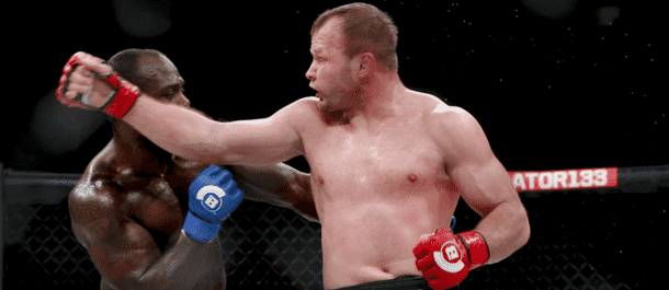 Title Alexander Shlemenko spinning back fist at Bellator