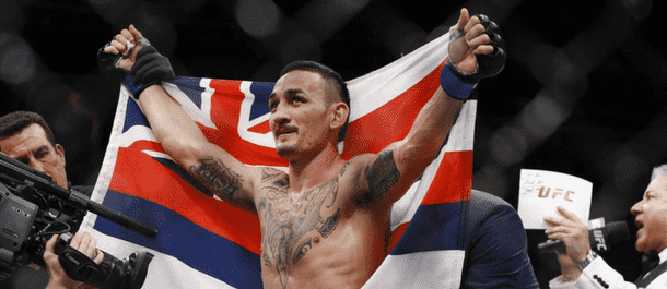 Max Holloway celebrates after defeating Jose Aldo