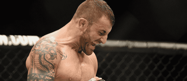 Alexander Volkanovski celebrates a UFC win