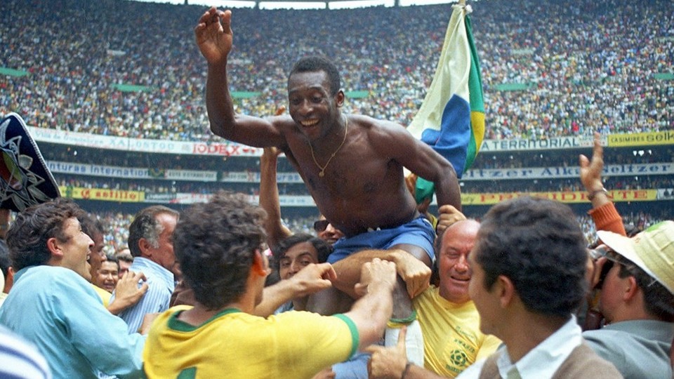 Brazil's Pele is hoisted on shoulders of his teammates