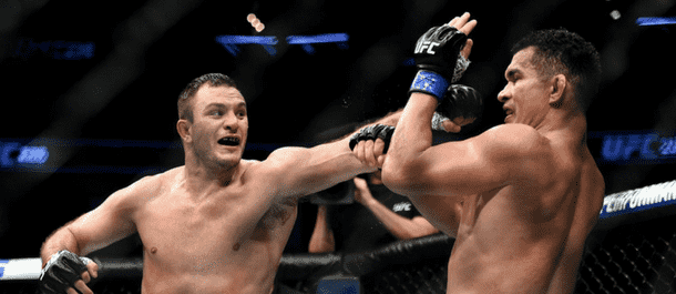 Gian Villante throws a punch inside the Octagon