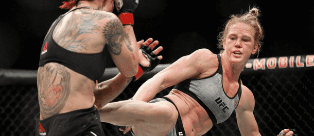 Holly Holm connects with a kick vs. Cris Cyborg