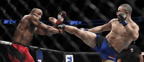 Robert Whittaker goes high with a kick against Yoel Romero