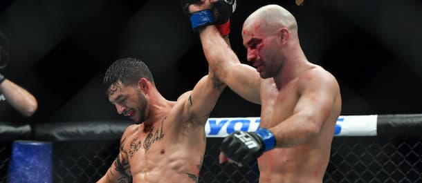 Artem Lobov and Cub Swanson raise their hands after a UFC main event war