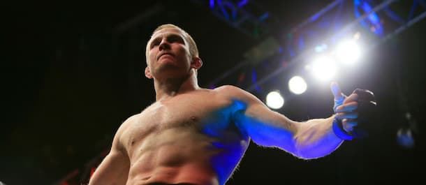 Misha Cirkunov climbs the UFC cage after securing an impressive victory