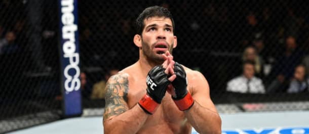 Raphael Assuncao takes a moment after securing a UFC victory
