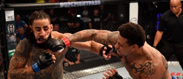 Greg Hardy lands a KO punch on his opponent in the UFC