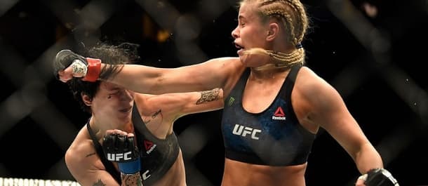 Paige VanZant throws a spinning right back fist to her opponent