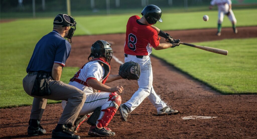 Batter swinging at ball during baseball game