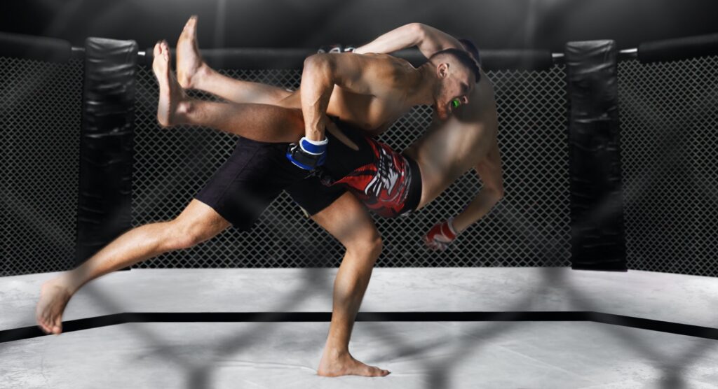 MMA fighter taking down opponent MMA fighter taking down opponent