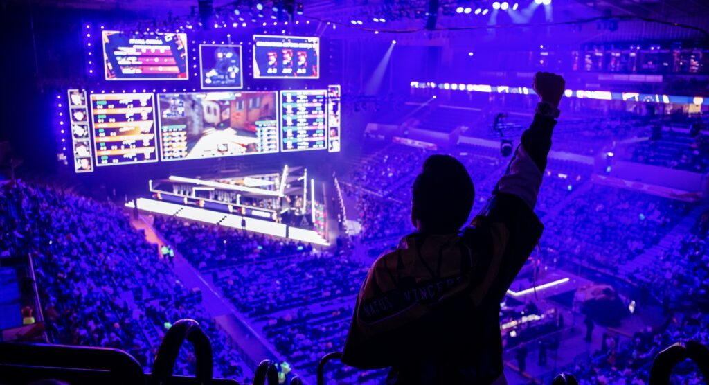 Fan raising clenched fist at esports event