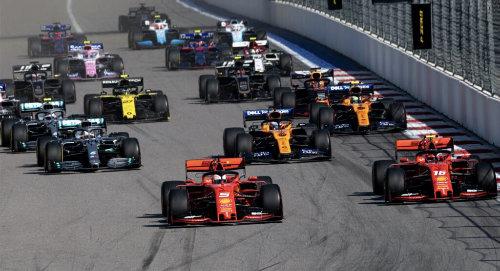 Formula 1 cars racing to first turn