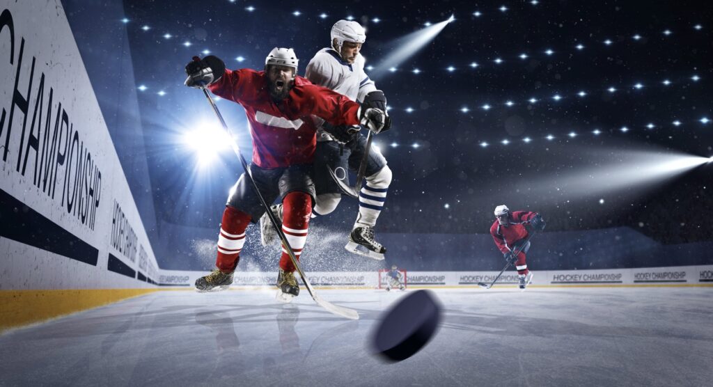 Two ice hockey players competing for the puck