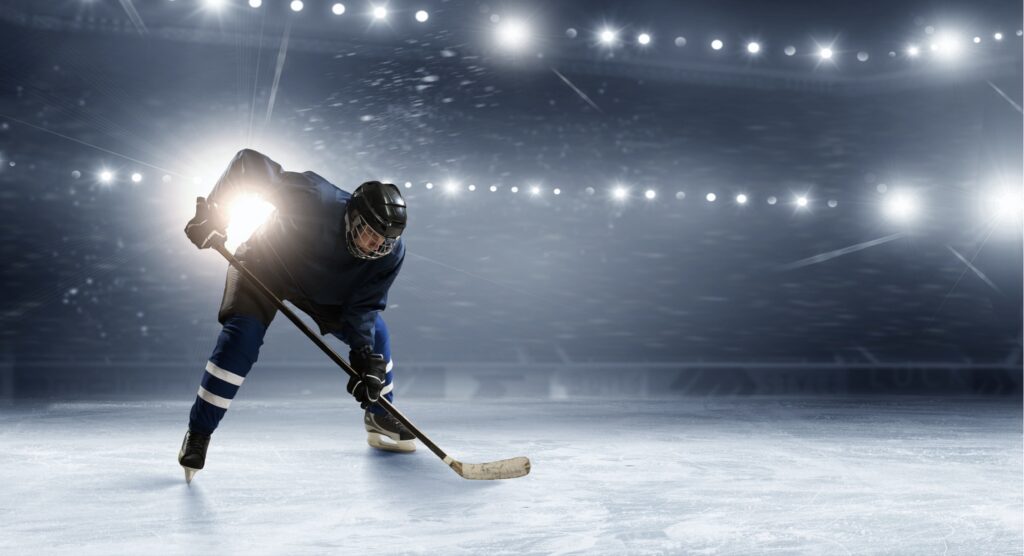 Ice hockey player on the ice rink