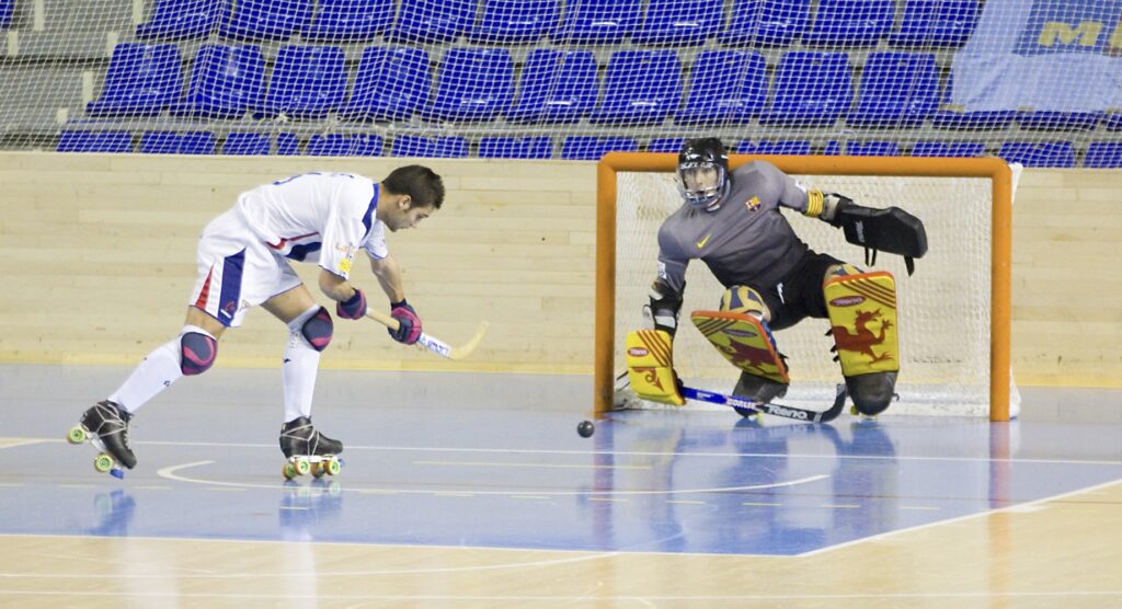 Player taking penalty during rink hockey match