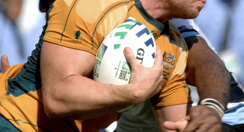 Rugby player being tackled