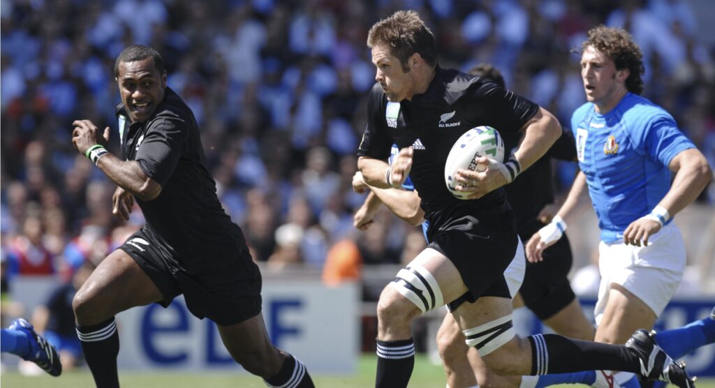 New Zealand rugby player running towards try line