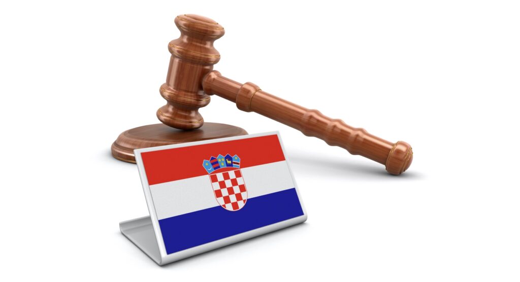 Wooden gavel and flag of Croatia