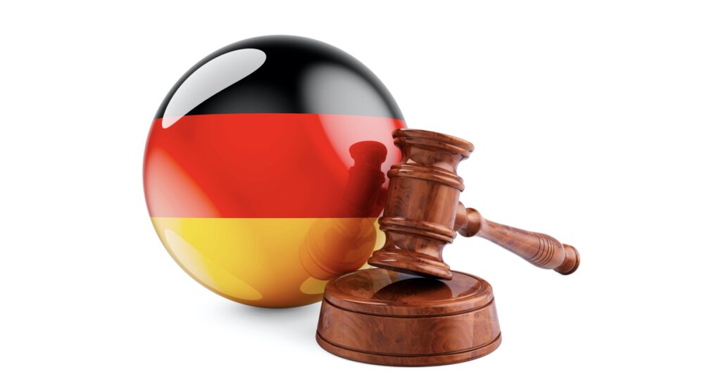 Wooden gavel and flag of Germany