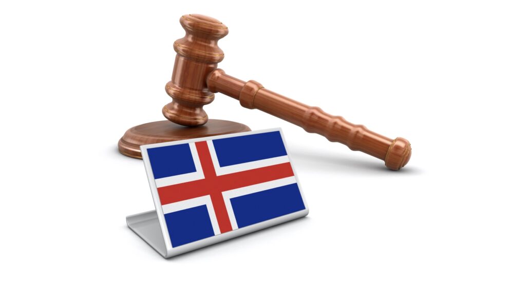 Wooden gavel and flag of Iceland