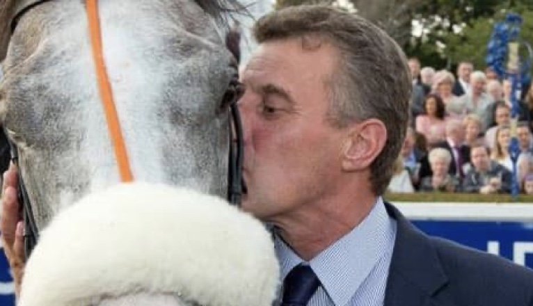 Kevin Ryan kissing a horse