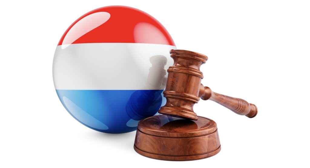 Wooden gavel and flag of Luxembourg