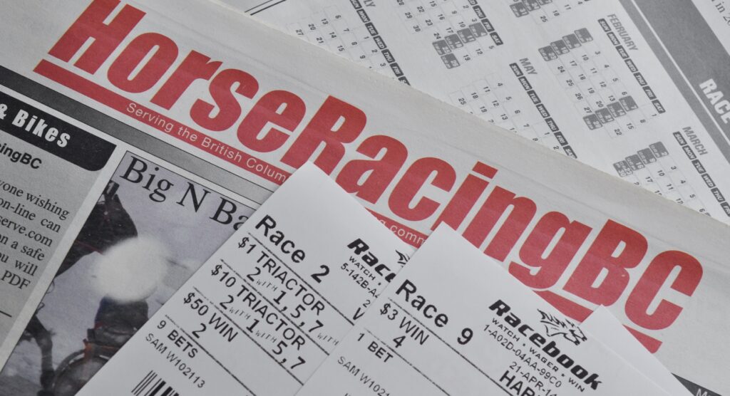 Betting slips on racing newspaper