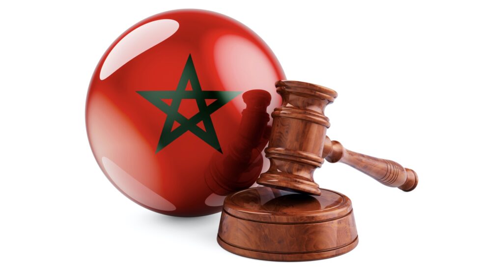 Wooden gavel and flag of Morocco