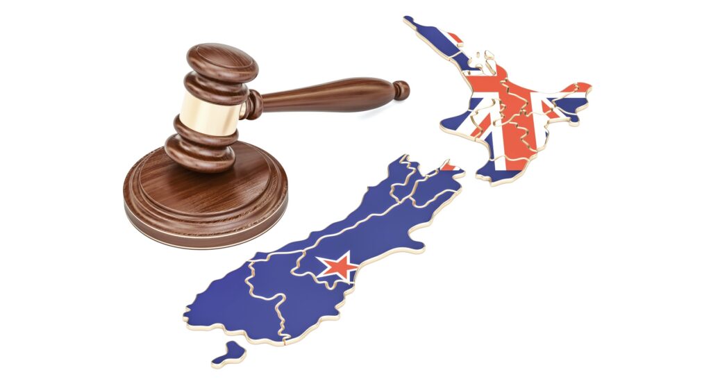 Wooden gavel and map of New Zealand