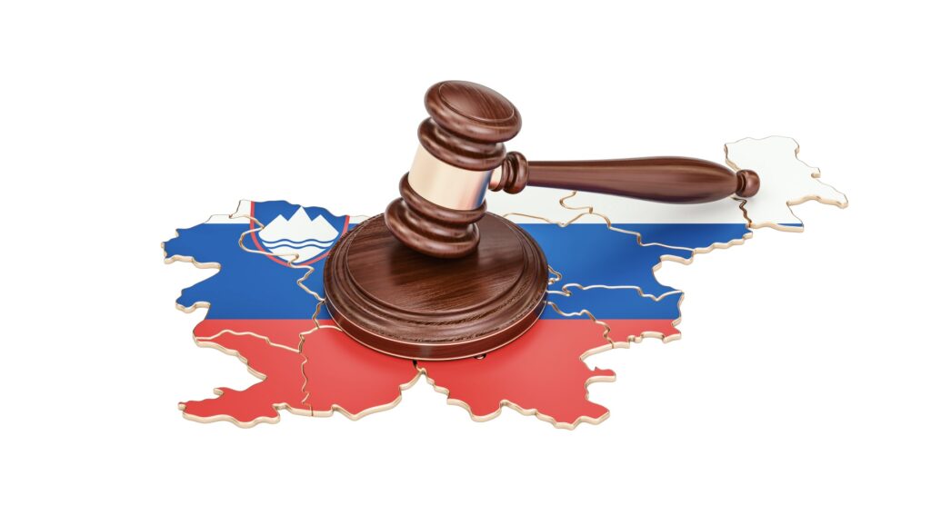 Wooden gavel and map of Slovenia
