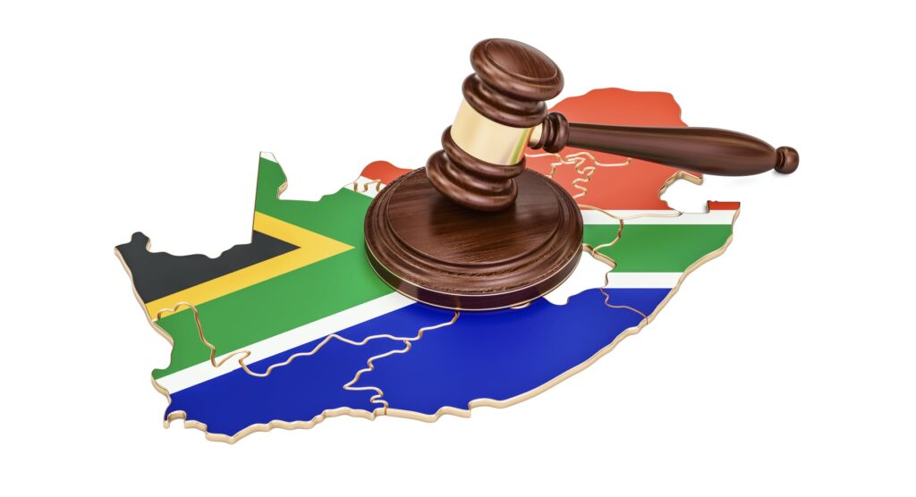 Wooden gavel and map of South Africa