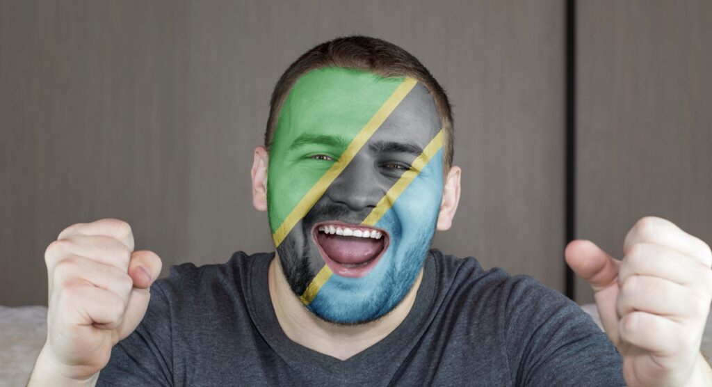 Fan with flag of Tanzania face paint
