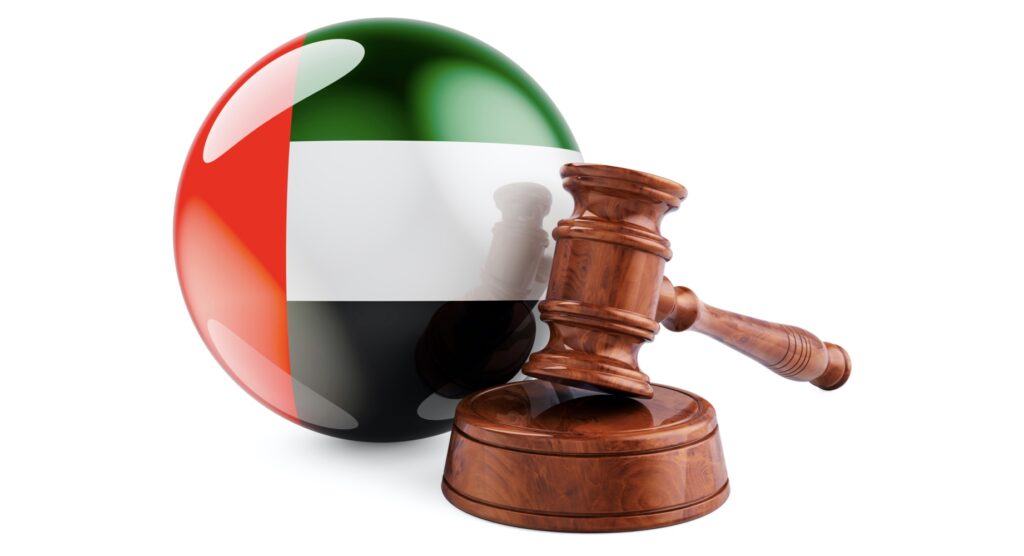 Wooden gavel and flag of UAE