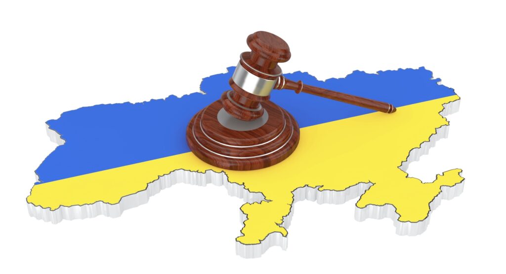 Wooden gavel and map of Ukraine
