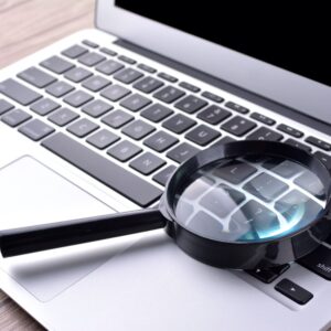 Magnifying glass on laptop