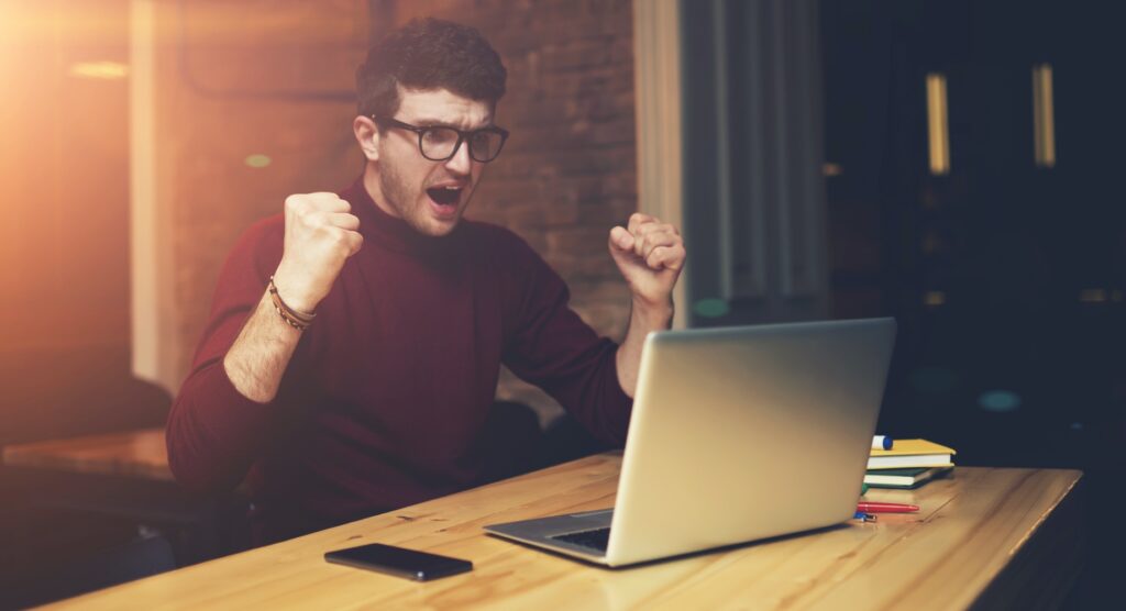 Man celebrating winning bet