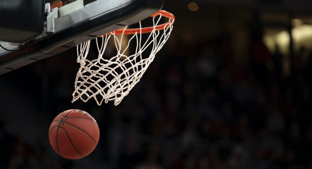 Basketball falling through net
