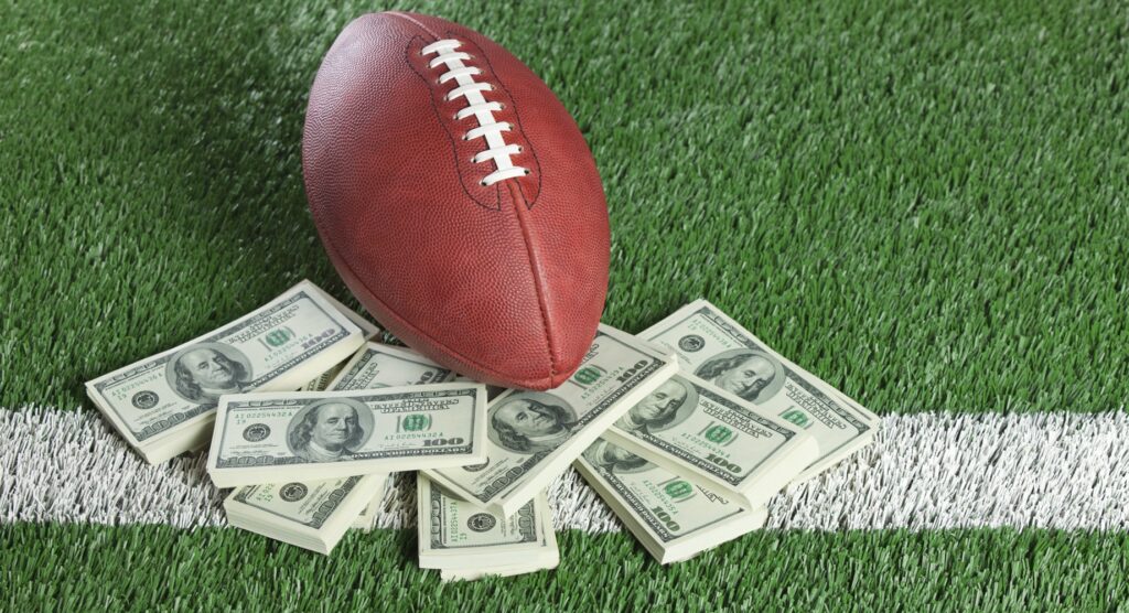 American football and bundles of cash