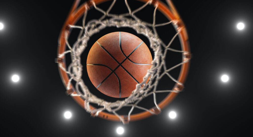 Basketball falling through net