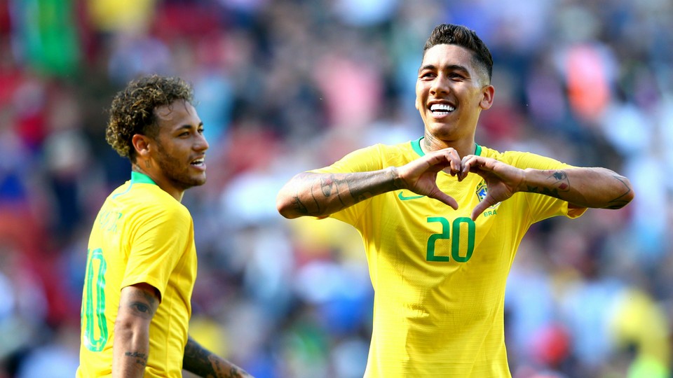 Roberto Firmino celebrating after scoring for Brazil