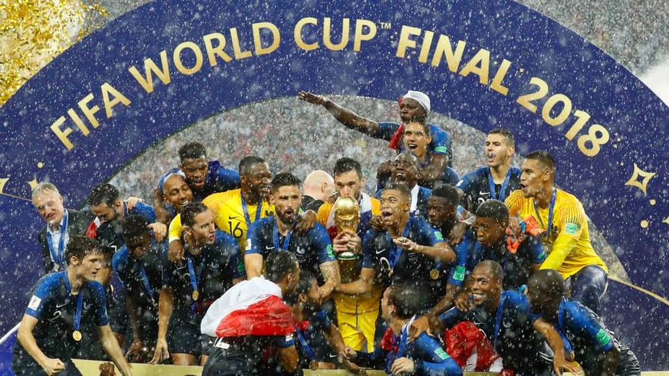 France lift the World Cup among a torrent of rain and golden ticker tape
