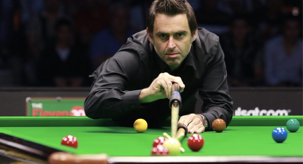 Snooker player Ronnie O'Sullivan playing a shot